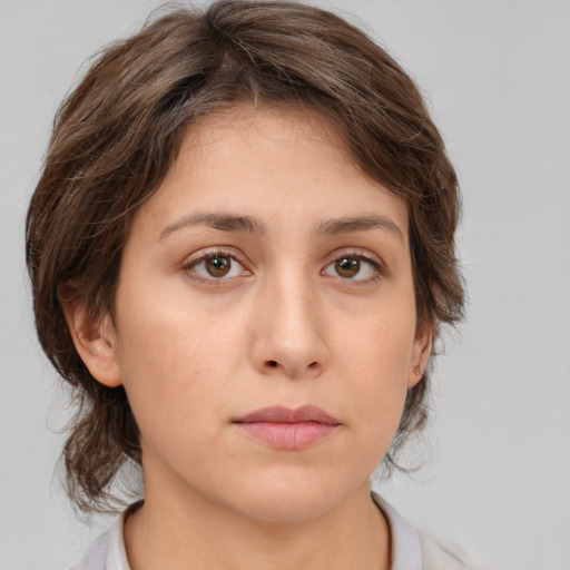 Neutral white young-adult female with medium  brown hair and brown eyes