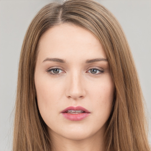 Neutral white young-adult female with long  brown hair and brown eyes