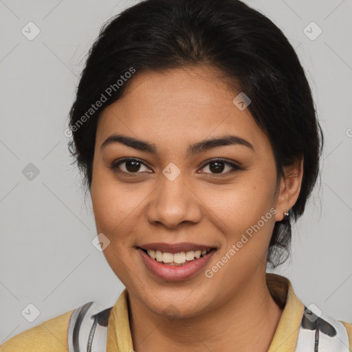 Joyful latino young-adult female with medium  brown hair and brown eyes