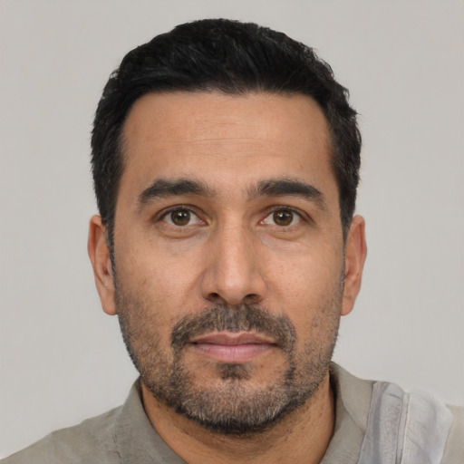 Neutral white adult male with short  black hair and brown eyes