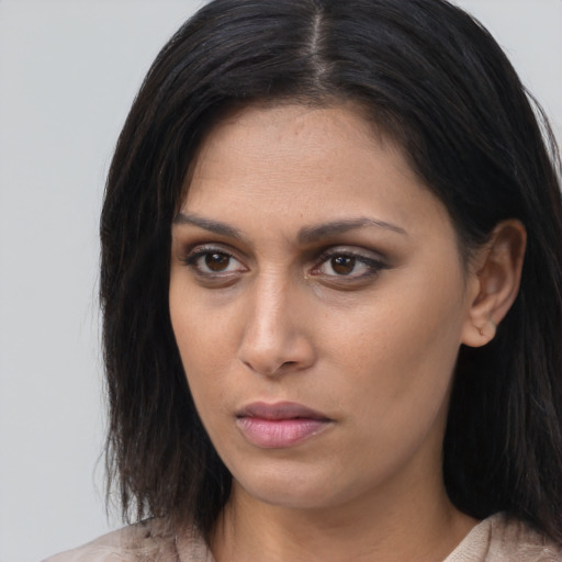 Neutral asian young-adult female with medium  brown hair and brown eyes