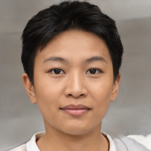 Joyful asian young-adult female with short  brown hair and brown eyes