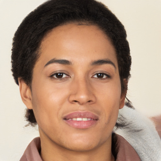 Joyful latino young-adult female with short  brown hair and brown eyes