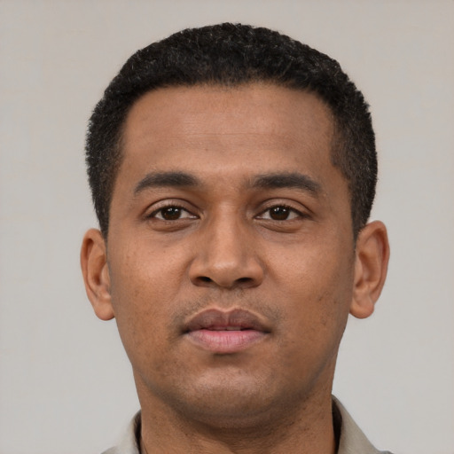 Neutral latino young-adult male with short  black hair and brown eyes