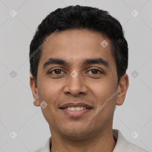 Joyful latino young-adult male with short  black hair and brown eyes