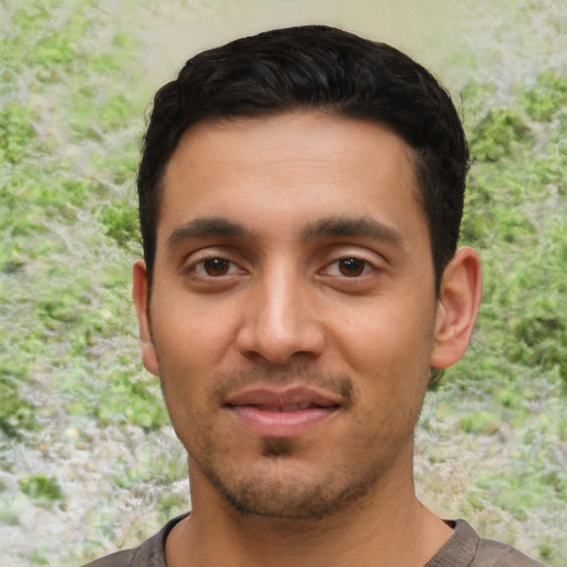 Joyful asian young-adult male with short  black hair and brown eyes