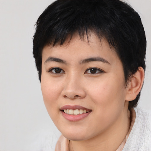 Joyful asian young-adult female with short  black hair and brown eyes