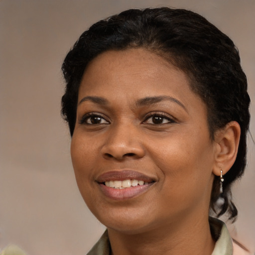 Joyful black young-adult female with medium  black hair and brown eyes