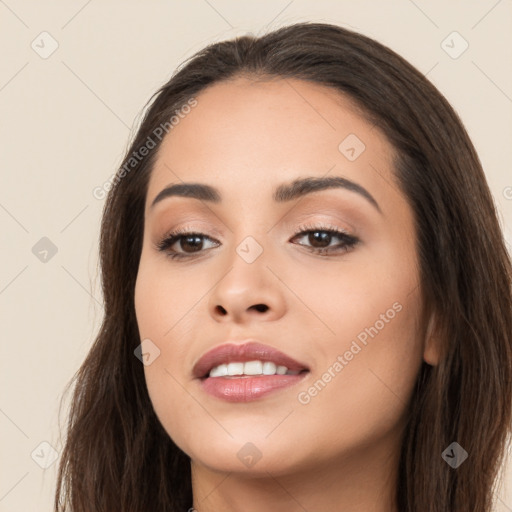 Joyful white young-adult female with long  brown hair and brown eyes