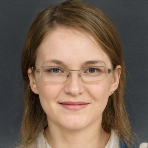 Joyful white young-adult female with long  brown hair and blue eyes