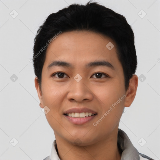 Joyful asian young-adult male with short  black hair and brown eyes