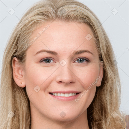 Joyful white young-adult female with long  brown hair and blue eyes