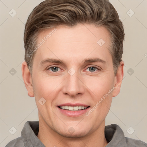 Joyful white adult male with short  brown hair and grey eyes