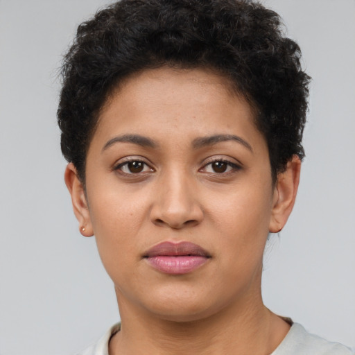 Joyful latino young-adult female with short  brown hair and brown eyes