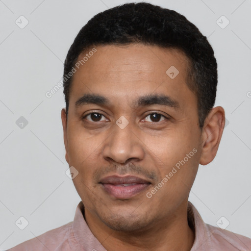 Joyful latino young-adult male with short  black hair and brown eyes