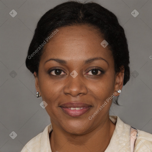 Joyful black adult female with short  brown hair and brown eyes