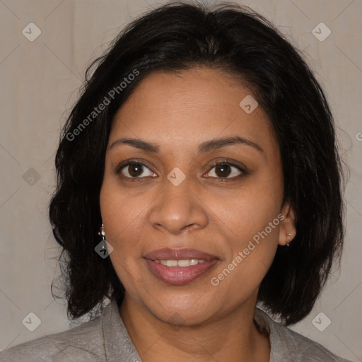 Joyful black adult female with medium  brown hair and brown eyes