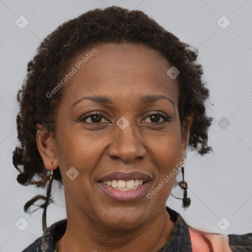 Joyful black adult female with short  brown hair and brown eyes