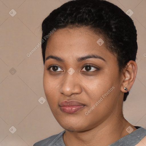 Joyful black young-adult female with short  black hair and brown eyes