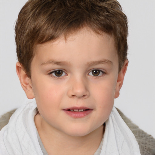 Joyful white child male with short  brown hair and brown eyes