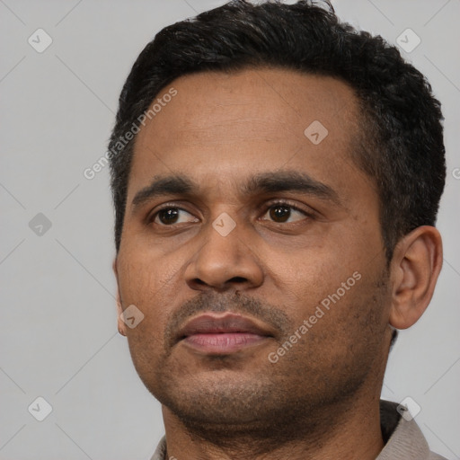 Neutral black young-adult male with short  black hair and brown eyes