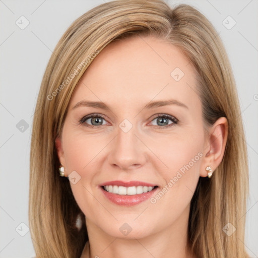 Joyful white young-adult female with long  brown hair and blue eyes