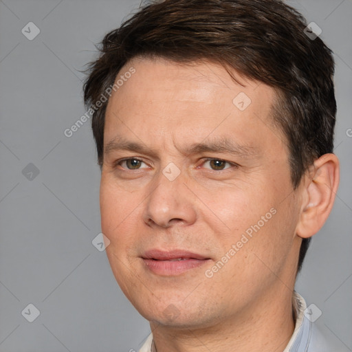 Joyful white adult male with short  brown hair and brown eyes