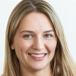 Joyful white young-adult female with long  brown hair and blue eyes