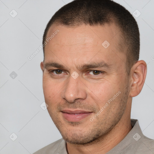 Joyful white adult male with short  brown hair and brown eyes