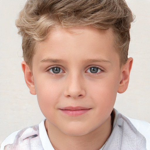 Joyful white child male with short  brown hair and blue eyes