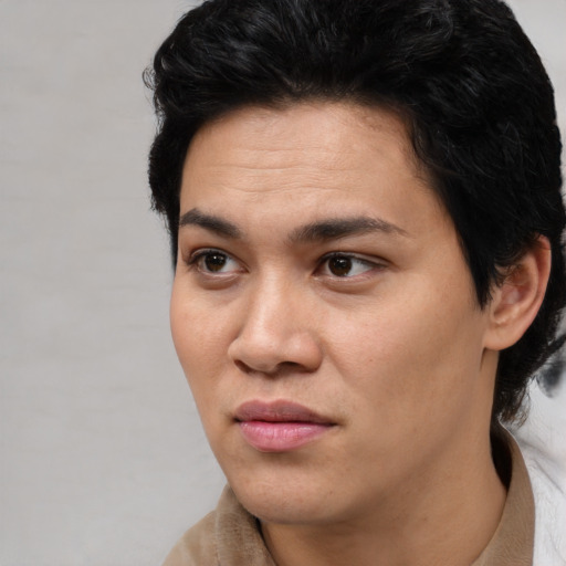 Joyful asian young-adult female with short  black hair and brown eyes
