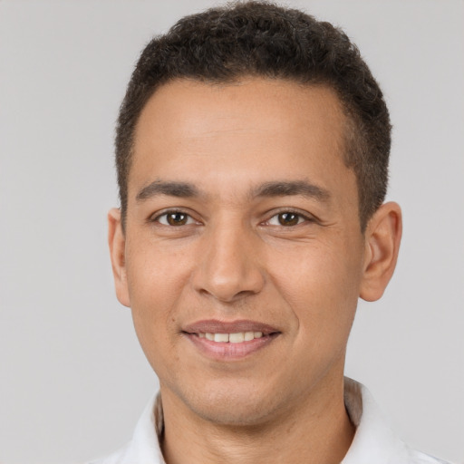 Joyful white young-adult male with short  brown hair and brown eyes