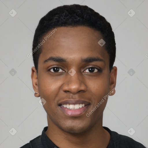 Joyful black young-adult male with short  black hair and brown eyes