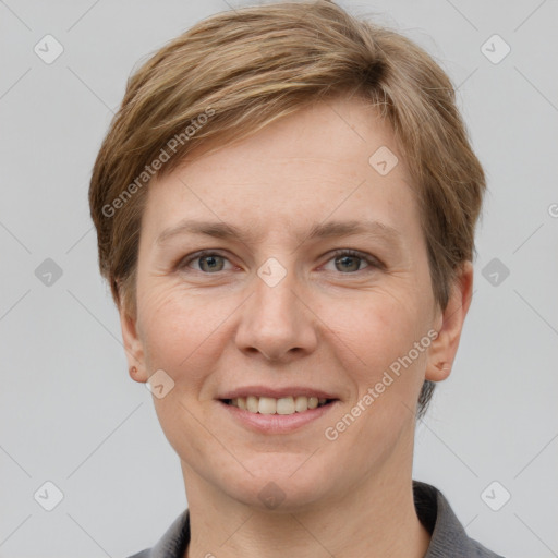 Joyful white adult female with short  brown hair and grey eyes