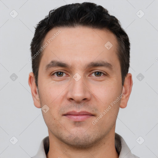 Joyful white young-adult male with short  brown hair and brown eyes