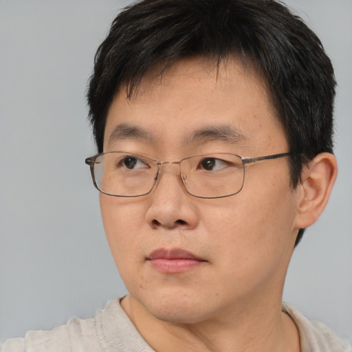 Neutral asian young-adult male with short  brown hair and brown eyes