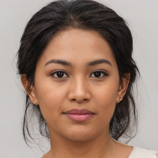 Joyful asian young-adult female with medium  brown hair and brown eyes