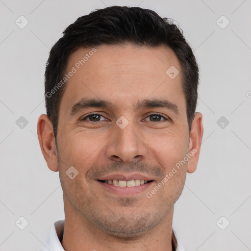 Joyful white young-adult male with short  brown hair and brown eyes