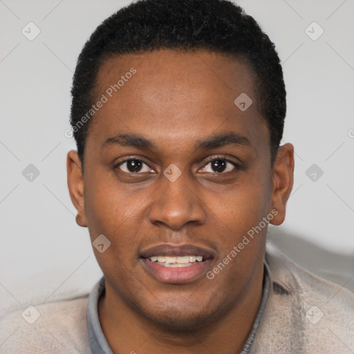 Joyful black young-adult male with short  black hair and brown eyes