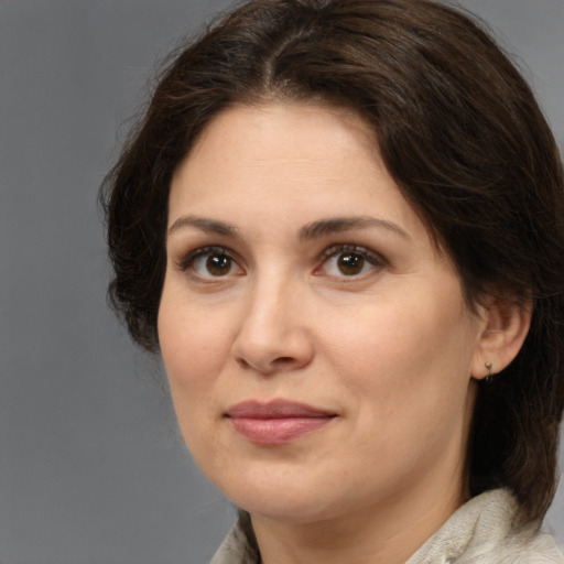 Joyful white young-adult female with medium  brown hair and brown eyes