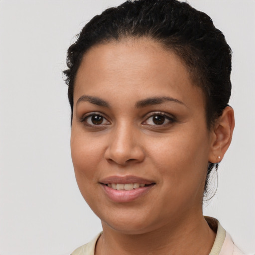 Joyful latino young-adult female with short  brown hair and brown eyes