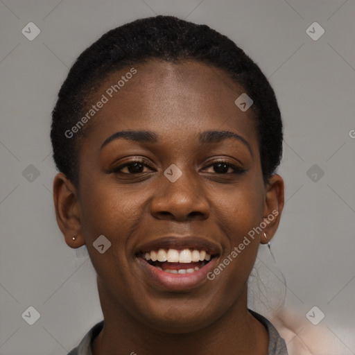 Joyful black young-adult female with short  black hair and brown eyes