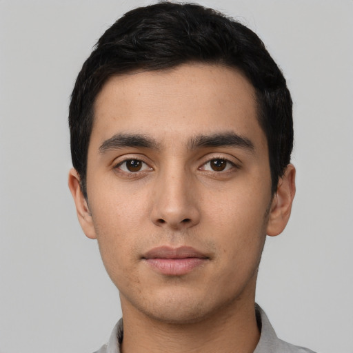 Neutral latino young-adult male with short  black hair and brown eyes