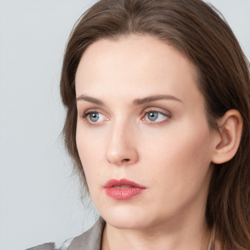 Neutral white young-adult female with long  brown hair and grey eyes