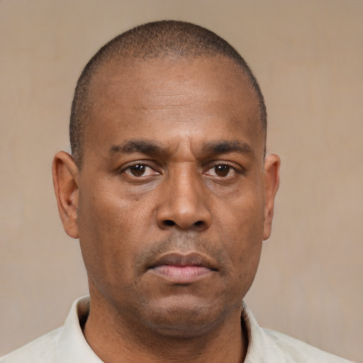 Neutral latino adult male with short  brown hair and brown eyes