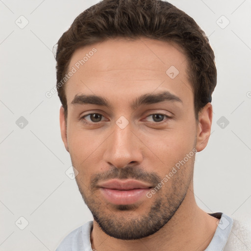 Neutral white young-adult male with short  brown hair and brown eyes