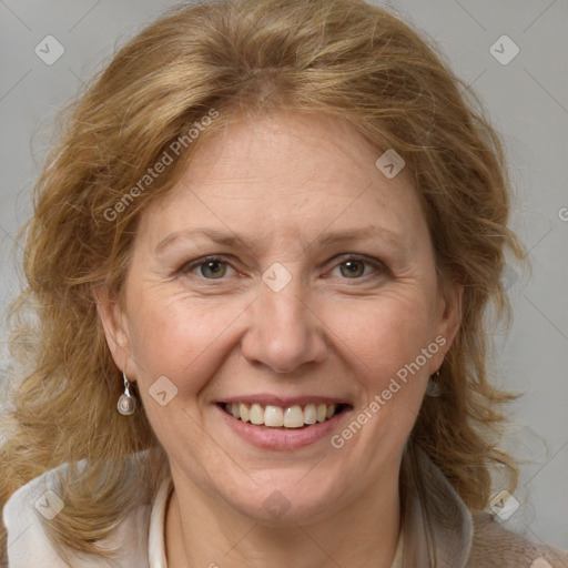 Joyful white adult female with medium  brown hair and blue eyes