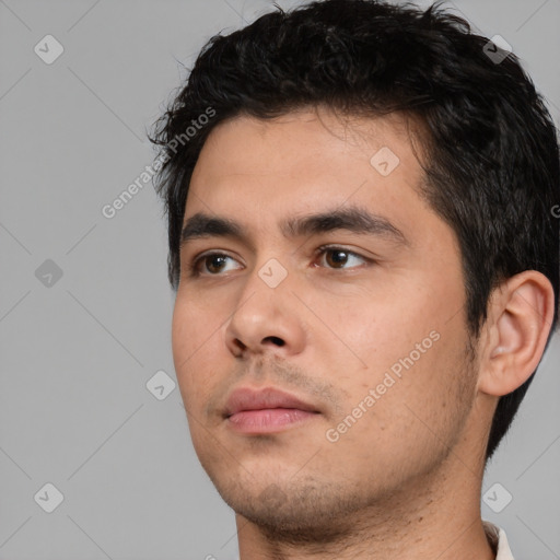 Neutral white young-adult male with short  black hair and brown eyes