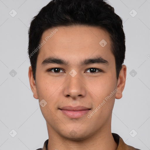 Joyful latino young-adult male with short  black hair and brown eyes