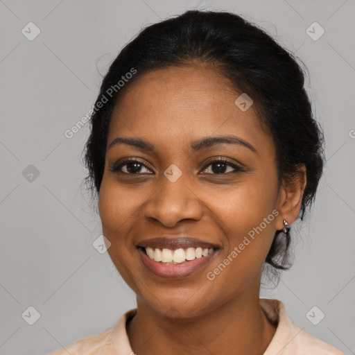 Joyful black young-adult female with medium  black hair and brown eyes